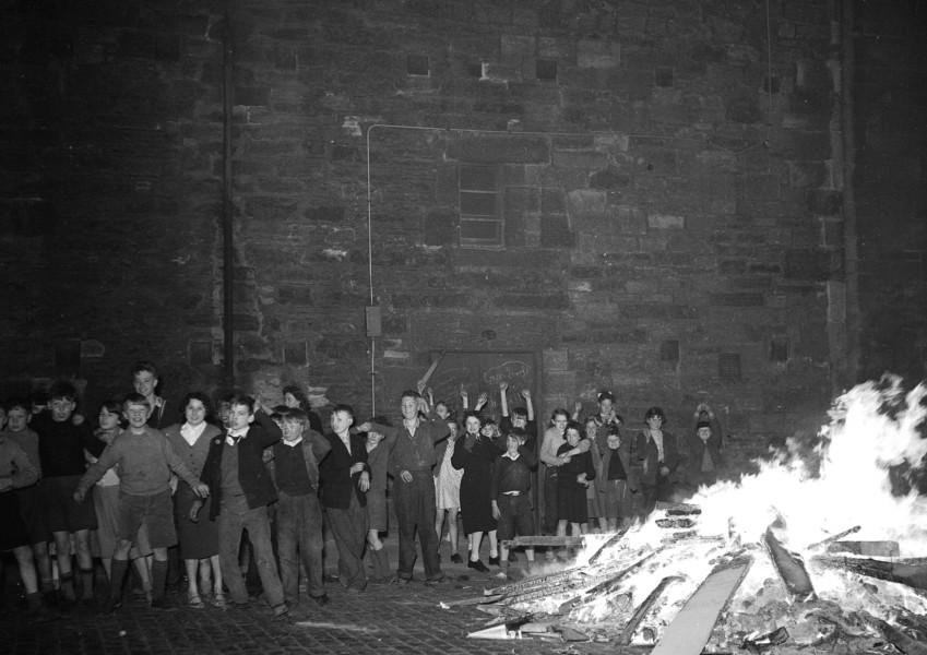 Bonfire watched by children in Dumbiedykes - Holyrood area on 5th November, 1956.