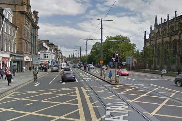 The CityLink bus has come to a halt at the west end of Princes Street, outside McDonald's, on the eastbound carriageway.