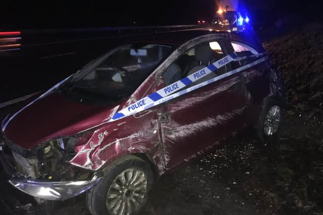 The damaged car.