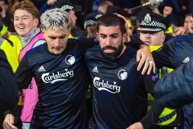 Michael Santos, right, is led away after Copenhagen score their second goal at Parkhead. Picture: SNS