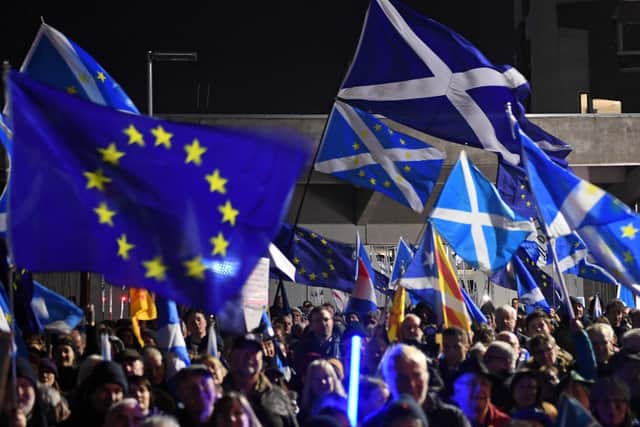 Pro-EU demonstrators campaign outside the Scottish Parliament on Brexit Day last month