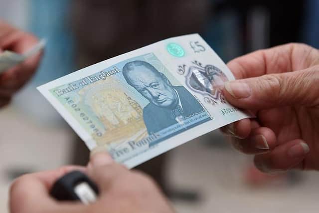 Winston Churchill on the polymer 5 note.